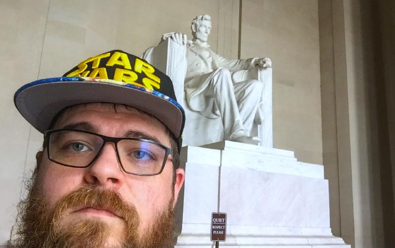 It's a picture of toddle me, at 3 years old holding a stuffed Eeyore from Winnie the Pooh